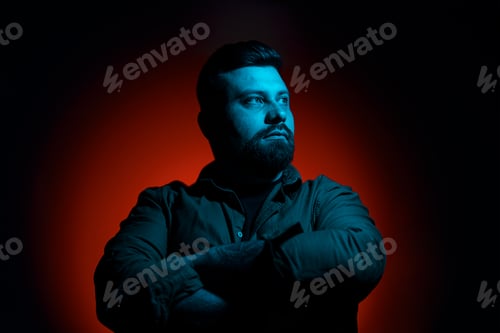 Preview: Confident man with crossed arms in neon light