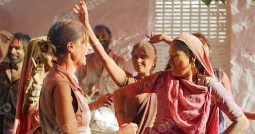 Preview: Multiethnic group of happy cheerful people celebrating the festival of Holi, India