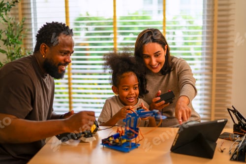 Preview: Parent is teaching her daughter robotic objects.
