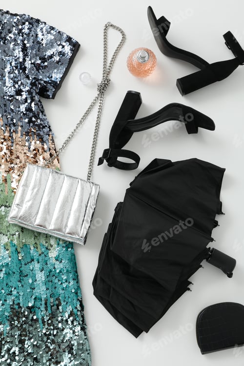 Preview: Stylish female clothes and accessories with umbrella