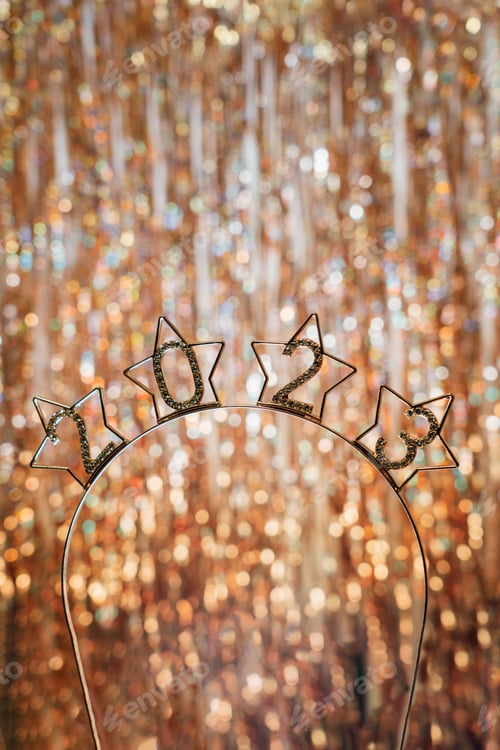 Preview: Happy New Year 2023. Beautiful holiday frame with creative metal text 2023 on golden background.