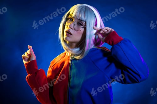Preview: Young woman with grey hair dancing and celebrate. Colored gel portraits