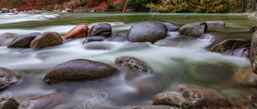 Preview: Fresh Water flowing around smooth rocks in Canadian Nature Landscape