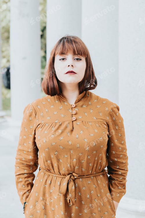 Preview: Modern serious pose portrait she her hipster redhead young woman.