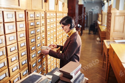 Preview: Woman Working in Library