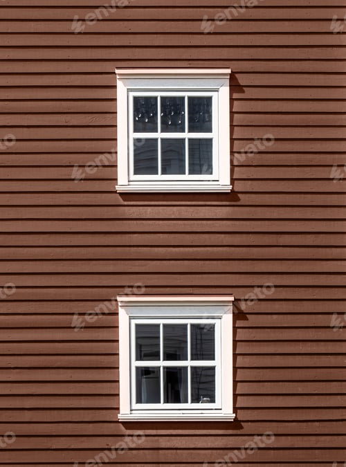 Preview: Two floors of windows on a red wooden facade