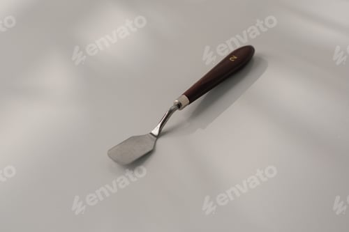 Preview: pastry spatula palette knife cooking utensils for cakes on the table on white background close-up