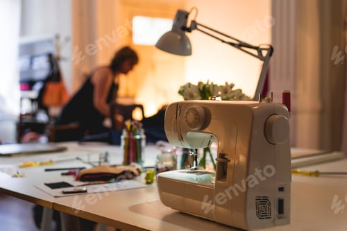 Preview: Modern sewing machine on table at fashion studio and showroom