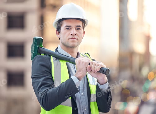 Preview: Cropped portrait of a handsome male construction worker standing with a hammer on a building site
