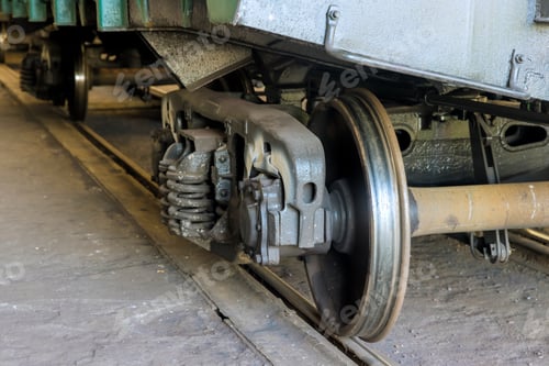 Preview: Train wheel and brake assembly in a depot showcasing essential mechanics and engineering design