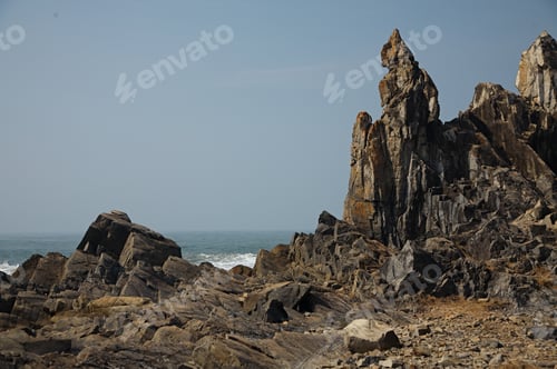 Preview: Sharp Rocks Protruding on Ocean Shore
