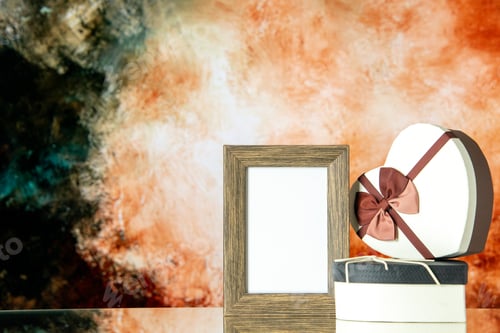 Preview: front view valentines day presents with picture frame on a light brown background love marriage