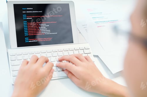 Preview: Young schoolchild computing in front of digital tablet