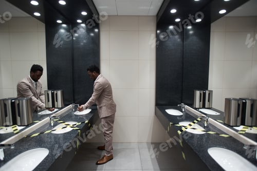 Preview: Businessman in Public Restroom