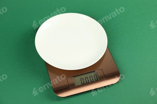 Preview: Electronic kitchen scale with plate on green background