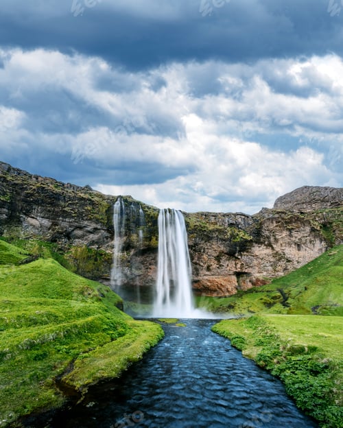 Preview: Seljalandfoss waterfall on Seljalandsa river with cloudy sky