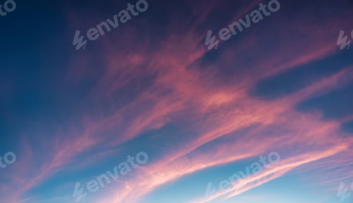 Preview: Colorful striped cloud and blue sky in the sunset