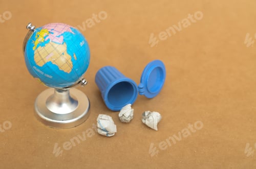 Preview: Global Waste Crisis: A Globe Beside a Tipped Trash Can with Discarded Paper