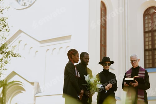 Preview: Family and Pastor Next to Grave