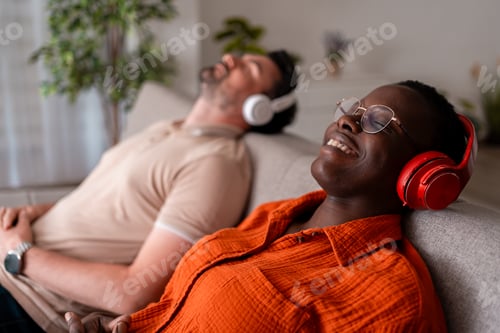 Preview: Relaxed individuals enjoying music while lounging on a comfortable couch