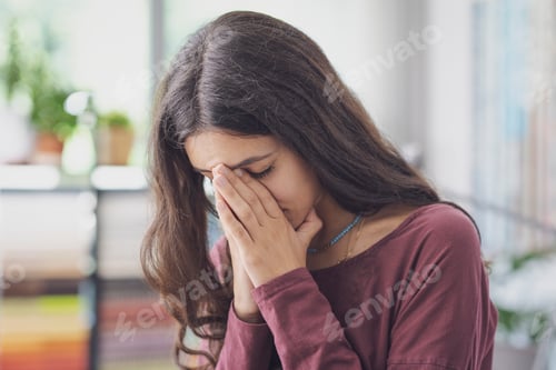Preview: Stressed sad woman posing indoors