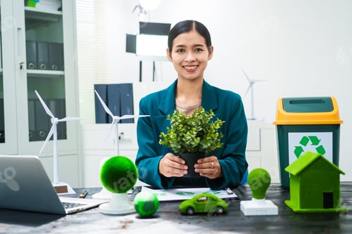 Preview: An Asian businesswoman sits at her desk, discussing clean energy solutions their impact on homes