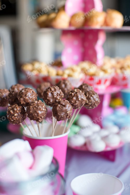 Preview: Chocolate cakepops on holiday dessert table at kid birthday party