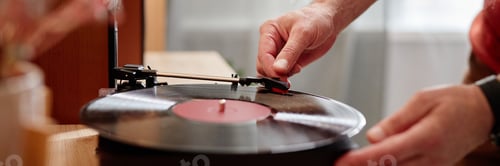 Preview: Senior Man Setting Up Retro Record Player at Home