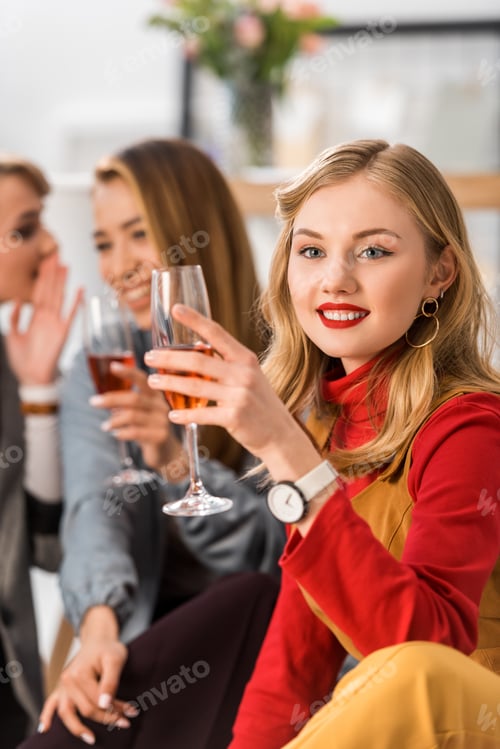 Preview: beautiful magazine editors celebrating with champagne in modern office