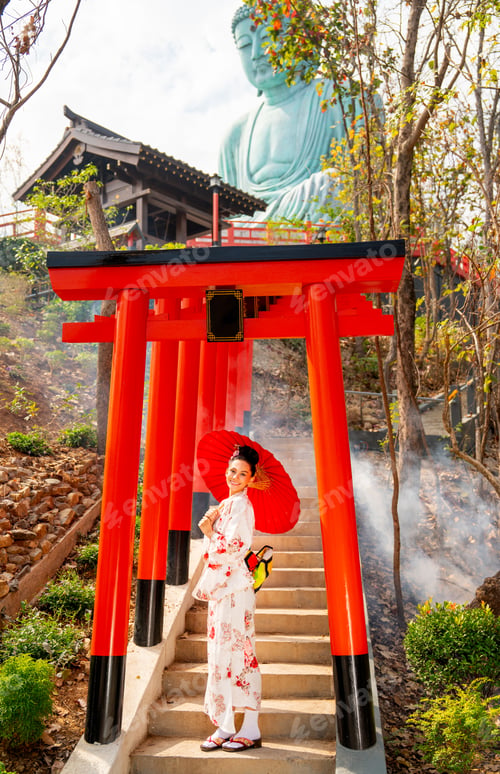 Preview: Wide shot of young woman wear japanese style dress also hold red umbrella stand on stair