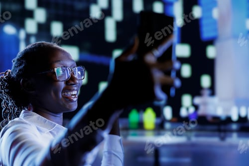 Preview: Woman does selfie in city at night