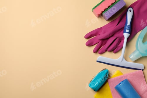 Preview: Different cleaning tools on beige background, space for text