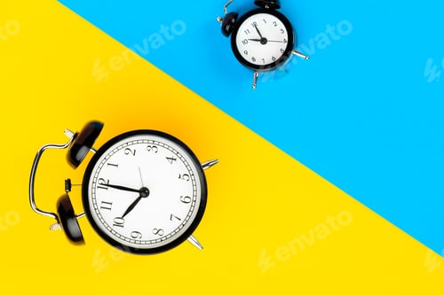 Preview: Black alarm clock on color block yellow and blue background