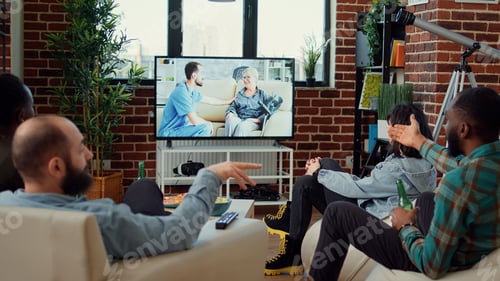 Preview: Happy people having fun watching movie on tv channel