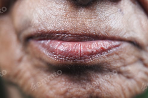 Preview: Close-up of an elderly person's lips highlighting age and wisdom