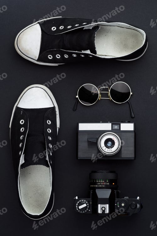 Preview: Sneakers, photo camera, and round sunglasses