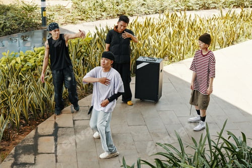 Preview: Expressive Group Practicing Dance Moves Outdoors