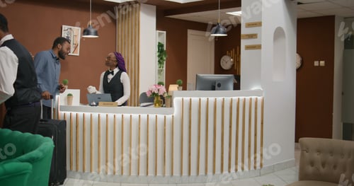 Preview: Hotel guest getting room access card
