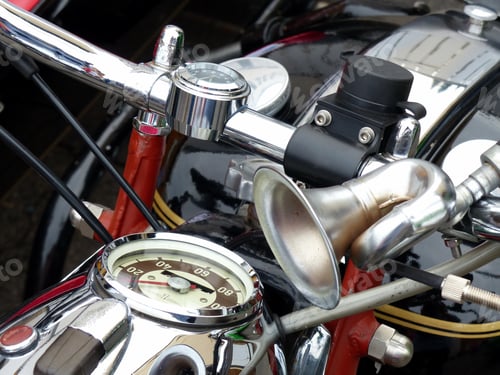 Preview: Closeup of highly polished chrome parts of an old motorcycle