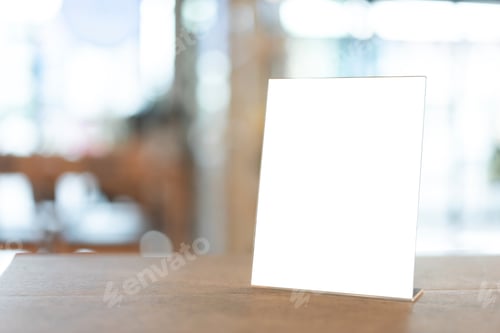 Preview: Restaurant menu frame with white blank screen on wooden table in restaurant or cafe on background