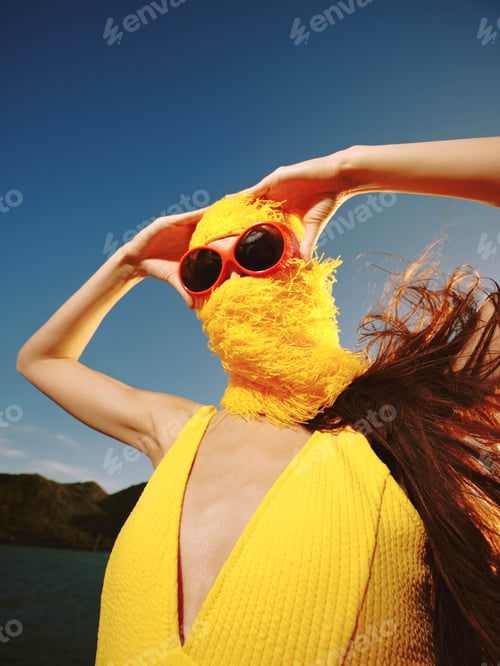Preview: Yellow dress, sunglasses, hat, woman, water a stylish woman in a vibrant yellow dress, wearing