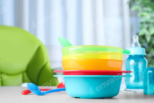 Preview: Bright child's dishware on grey table indoors