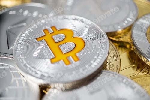 Preview: Close-up Of Bitcoin Physical Coin On Stack Of Many Other Cryptocurrencies