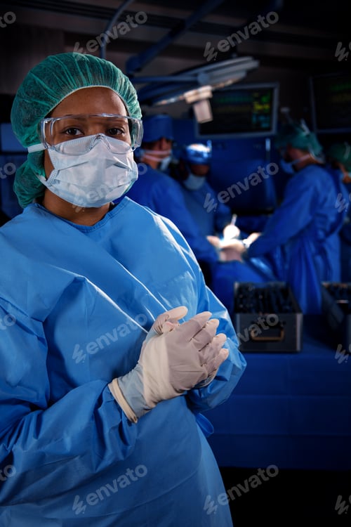 Preview: Portrait of African American frontline nurse wearing PPE