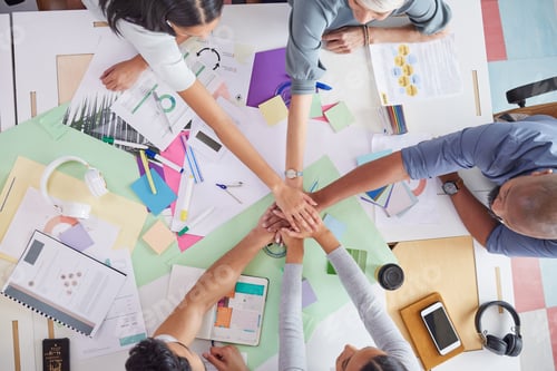 Preview: We have each others back in this team. Shot of a group of creative businesspeople having a meeting.