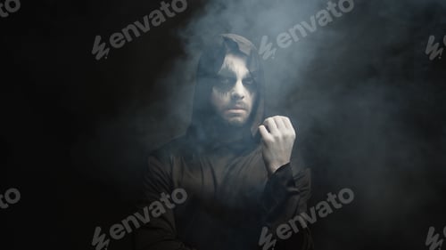 Preview: Man dressed up like grim reaper for halloween party