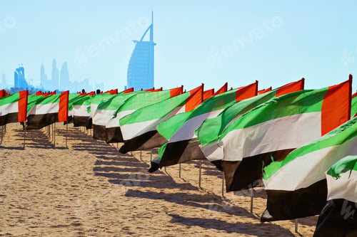 Preview: Many Flags of the United Arab Emirates waving in the wind. United Arab Emirates independence day