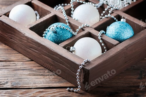 Preview: Box with christmas balls on the wooden table