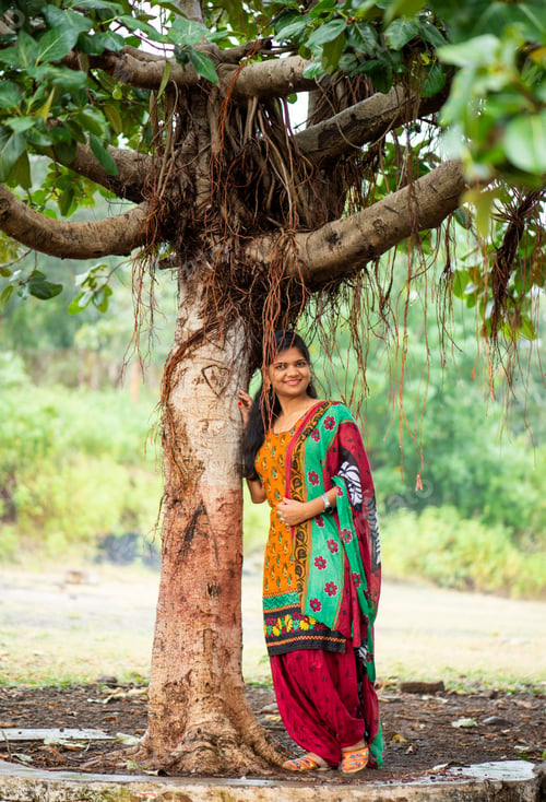 Preview: Happy young beautiful Indian woman at the park outdoor