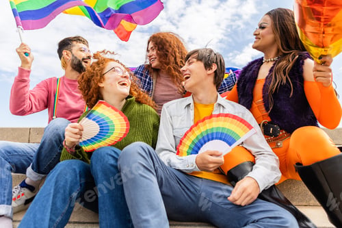 Preview: Happy diverse group of gay people celebrating together LGBT pride festival day